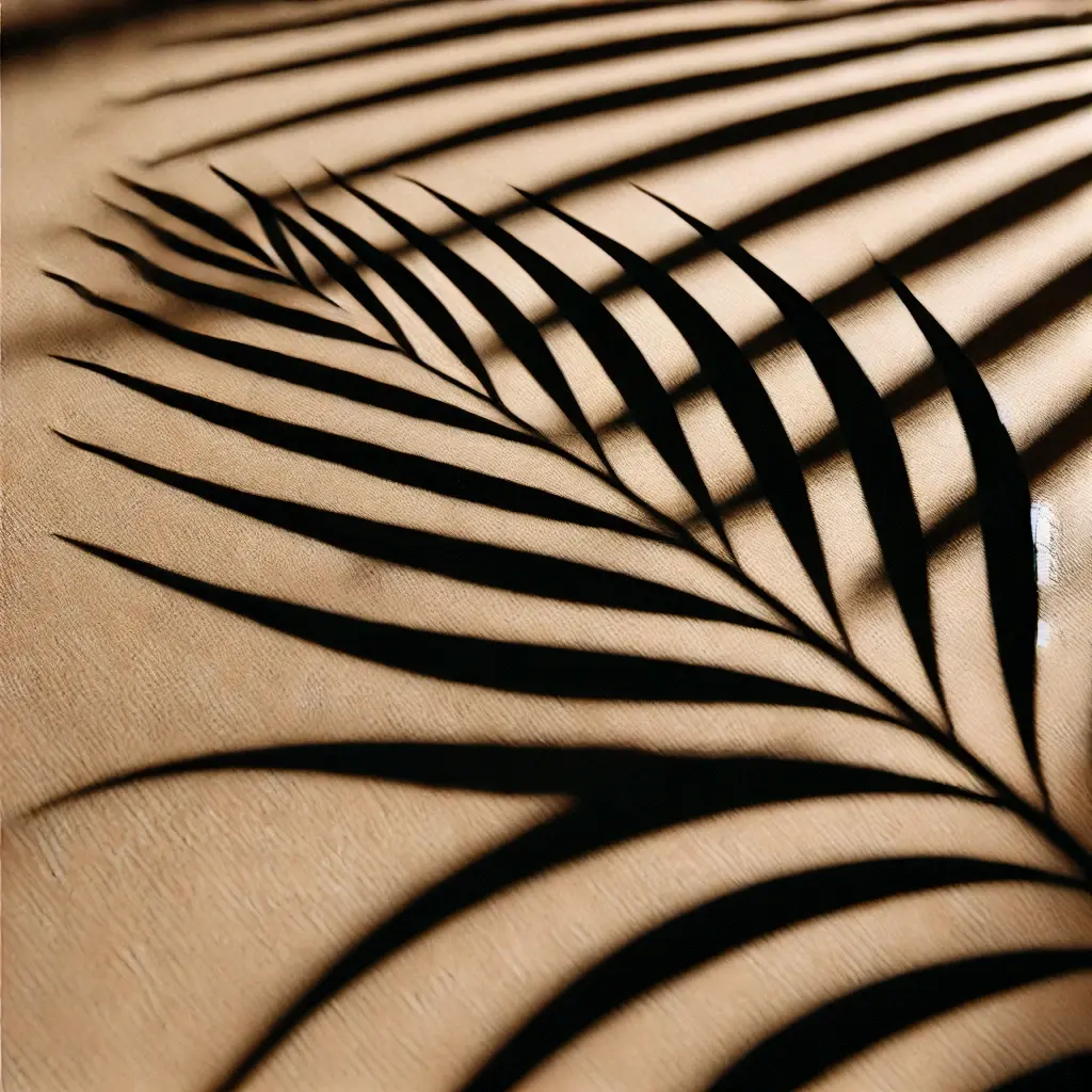 Image of palm leaves against tan background